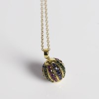 Lot 1737 - HIGH CARAT GOLD MULTI GEM SET PENDANT ON A...
