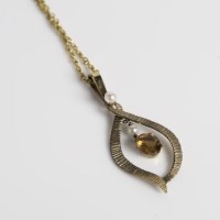 Lot 1741 - CITRINE AND PEARL PENDANT of droplet form, set...