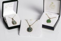 Lot 1743 - COLLECTION OF THREE GREEN GEM SET PENDANTS...