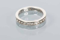 Lot 1754 - DIAMOND FULL ETERNITY RING channel set with...