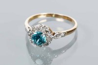 Lot 1760 - BLUE ZIRCON AND DIAMOND CLUSTER RING with a...