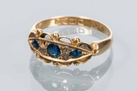 Lot 1779 - SAPPHIRE AND DIAMOND RING set with a central...