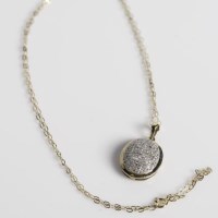 Lot 1796 - DIAMOND CLUSTER PENDANT of oval form, with...