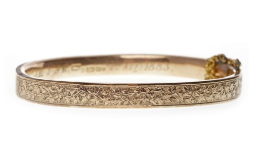 Lot 43 - VICTORIAN NINE CARAT GOLD BANGLE with engraved...