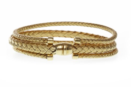 Lot 118 - WOVEN BRACELET formed by three woven strands,...