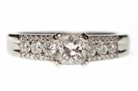 Lot 119 - PLATINUM DIAMOND RING set with a central...