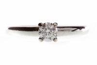 Lot 289 - DIAMOND SOLITAIRE RING set with a round...