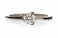 Lot 307 - PLATINUM DIAMOND SOLITAIRE RING with a three...