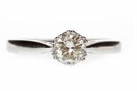 Lot 379 - DIAMOND SOLITAIRE RING set with a round...