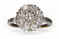 Lot 384 - DIAMOND FLOWER CLUSTER RING set with round...