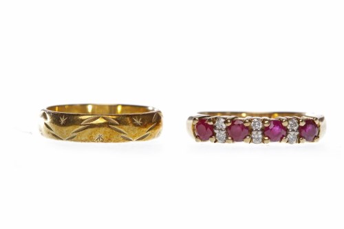 Lot 433 - NINE CARAT GOLD RUBY RING set with round...