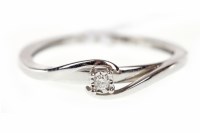 Lot 489 - NINE CARAT WHITE GOLD DIAMOND RING with a...