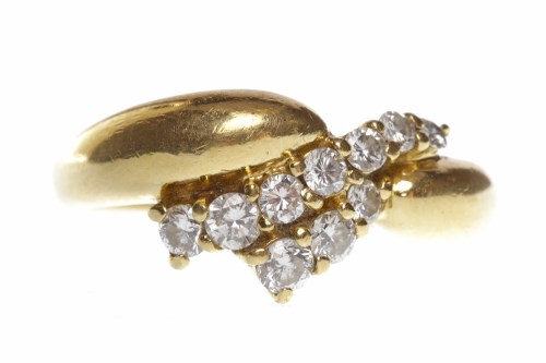Lot 497 - EIGHTEEN CARAT GOLD DIAMOND SET RING with a...