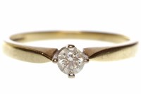 Lot 537 - NINE CARAT GOLD DIAMOND SOLITAIRE RING with a...