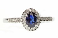 Lot 538 - SAPPHIRE AND DIAMOND CLUSTER RING set with a...