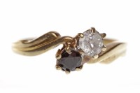 Lot 563 - NINE CARAT GOLD GEM SET TWO STONE RING with a...
