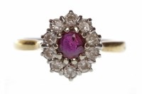 Lot 607 - EIGHTEEN CARAT GOLD RUBY AND DIAMOND CLUSTER...