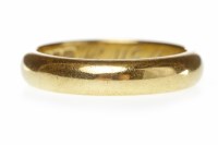 Lot 652 - EIGHTEEN CARAT GOLD WEDDING BAND with personal...