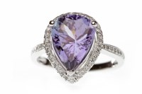 Lot 681 - TANZANITE AND DIAMOND CLUSTER RING set with a...