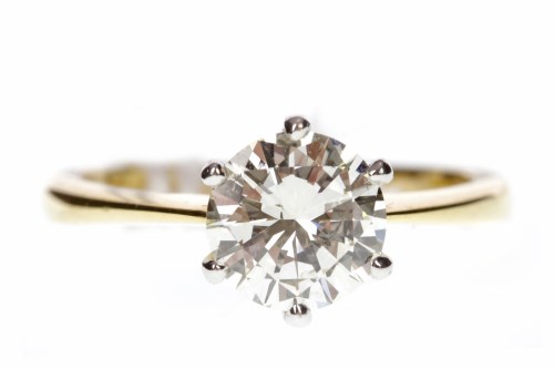 Lot 717 - DIAMOND SOLITAIRE RING with a six claw set...