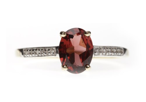 Lot 780 - NINE CARAT GOLD GARNET AND DIAMOND RING set...