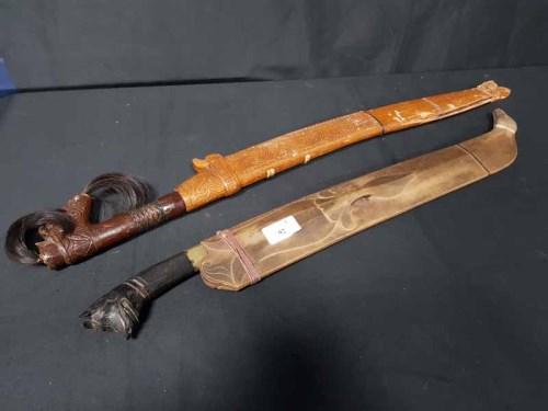 Lot 92 - SARAWAK SWORD with carved wooded handle and...