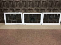 Lot 260 - SET OF THREE LEADED GLASS WINDOWS the central...