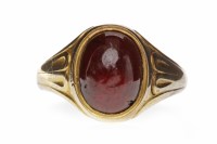 Lot 89 - RED PASTE DRESS RING set with an oval cabochon...