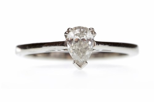 Lot 374 - PLATINUM DIAMOND SOLITAIRE RING with a three...