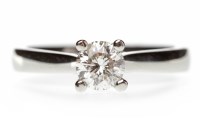 Lot 376 - PLATINUM DIAMOND SOLITAIRE RING with a round...