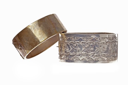 Lot 20 - TWO NINETEENTH CENTURY BANGLES one continental...