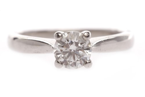 Lot 111 - DIAMOND SOLITAIRE RING set with a round...