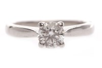 Lot 111 - DIAMOND SOLITAIRE RING set with a round...