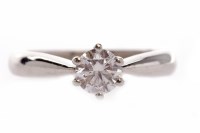 Lot 129 - DIAMOND SOLITAIRE RING set with a round...