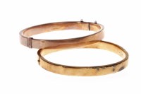 Lot 207 - TWO VICTORIAN BANGLES both of oval form, one...