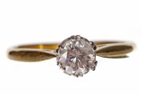 Lot 215 - DIAMOND SOLITAIRE RING set with a round...