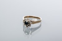 Lot 1895 - SAPPHIRE AND DIAMOND CLUSTER RING with a...