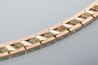 Lot 1921 - FOURTEEN CARAT GOLD BRACELET in two tone rose...