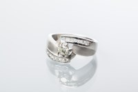 Lot 1929 - DIAMOND DRESS RING of crossover design, with a...