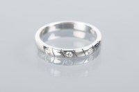Lot 1950A - FOURTEEN CARAT WHITE GOLD DIAMOND WEDDING BAND...