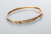 Lot 1951 - FIFTEEN CARAT GOLD VICTORIAN PEARL BANGLE set...