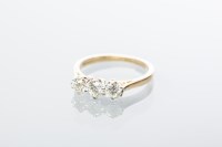 Lot 1982 - DIAMOND THREE STONE RING set with three...