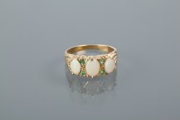Lot 2010A - SYNTHETIC OPAL AND EMERALD RING set with three...