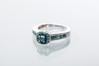Lot 2011 - BLUE DIAMOND DRESS RING set with a cluster of...