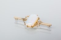 Lot 2015 - OPAL BAR BROOCH set with a cabochon opal,...