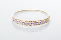 Lot 2026 - AMETHYST AND DIAMOND BANGLE set with nine...