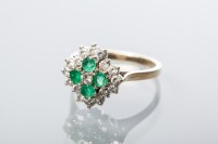 Lot 2034 - EMERALD AND WHITE GEM CLUSTER RING set with...
