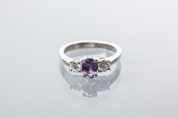 Lot 2035 - PINK SAPPHIRE AND DIAMOND THREE STONE RING the...
