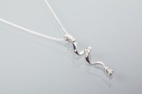 Lot 2044 - DIAMOND SET TWIST PENDANT ON CHAIN the pendant...