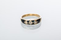 Lot 2046 - VICTORIAN MOURNING RING set with three rose...